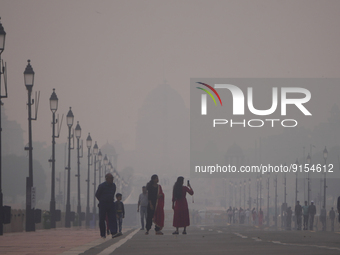 People click pictures as they visit Rashtrapati Bhavan, home to the President of the world's largest democracy, enveloped by smog and haze i...