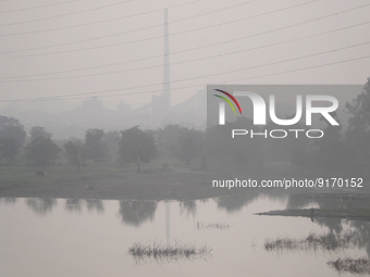 Rajghat Thermal Plant is seen amidst a dense layer of smog and haze along the banks of river Yamuna in New Delhi, India on November 6, 2022....