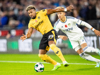 Wolvess Adama Traore and Mateo Joseph of Leeds during the Carabao Cup match between Wolverhampton Wanderers and Leeds United at Molineux, Wo...