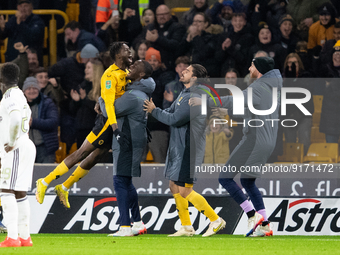 Boubacar Traore of Wolves  and substitutes celebrate scoring their side's first goal of the game during the Carabao Cup match between Wolver...