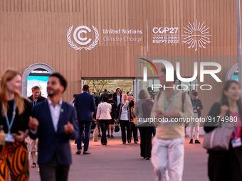 Participants walk in the open area on the fourth day of the COP27 UN Climate Change Conference, held by UNFCCC in Sharm El-Sheikh Internatio...