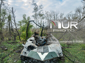 A burned russian armoured army vehicle lies in the forests around Vysokopillya, a recent liberated village by ukrainian army after the russi...