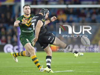New Zealand Halfback Jahrome Hughes kicks the ball forward during the 2021 Rugby League World Cup Semi Final match between Australia and New...