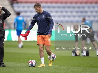Jerry Yates (9)of Blackpool FC warms up during the Sky Bet Championship match between Wigan Athletic and Blackpool at the DW Stadium, Wigan...