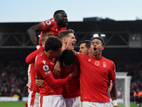 The Reds celebrate after Morgan Gibbs-White of Nottingham Forest scored a goal to make it 1-0 during the Premier League match between Nottin...