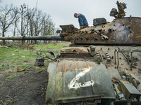 Remains of a destroyed russian tank with the Z symbol in the outskirts of Myroliubivka, a liberated village by ukrainian army of the russian...