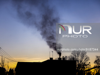 Dark smoke comes out of a village house's chimney in Chocznia, Lesser Poland Voivodeship, in southern Poland on November 12, 2022. Poland is...