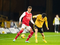 Arsenal's Ben White (L) and Wolvess Gonalo Guedes during the Premier League match between Wolverhampton Wanderers and Arsenal at Molineux, W...