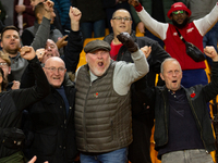 Arsenals fans in the stand celebrate after winning over Wolves during the Premier League match between Wolverhampton Wanderers and Arsenal a...