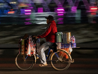 A street food vendor selling coffee on a street in Jakarta on 13 November 2022. Indonesia's economy expanded at its fastest pace in more tha...