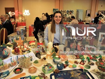 Palestinians attends Christmas Market exhibition for women's products, to support women, in East Jerusalem neighbourhood of Beit Hanina on N...