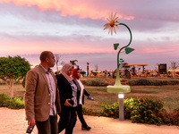 Visitors walk in the evening in the Green Zone of the COP27 UN Climate Change Conference, held by UNFCCC in Sharm El-Sheikh International Co...
