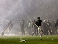 Clashes between riot police and PAO FC football fans, inside the stadium after the referee's decision to postpone the match. in Athens on No...