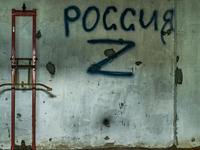 Graffiti painted by russian soldiers with the  symbol Z in support of the russian invasion of Ukraine in a building where ukrainians were to...