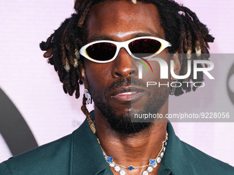 Saint Jhn (Carlos St. John Phillips) arrives at the 2022 American Music Awards (50th Annual American Music Awards) held at Microsoft Theater...