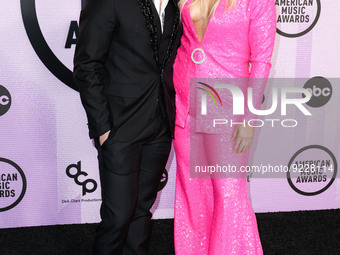 Chris Olsen and Meghan Trainor arrive at the 2022 American Music Awards (50th Annual American Music Awards) held at Microsoft Theater at L.A...