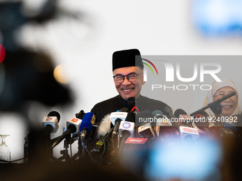 Malaysia's new Prime Minister, Anwar Ibrahim, smiles during his first press conference on November 24, 2022, at Kajang, Malaysia. He was nam...