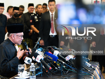 Malaysia's new Prime Minister, Anwar Ibrahim, reacts during his first press conference on November 24, 2022, at Kajang, Malaysia. He was nam...