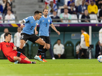 Jaesung Lee , Matias Vecino  during the World Cup match between Uruguay v Korea Republic in Doha, Qatar, on November 24, 2022. (