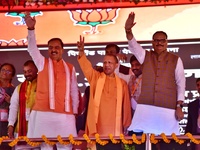 Uttar pradesh Chief minister Yogi adityanath (c) , deputy chief ministers Keshav prasad maurya and dr. Brijesh pathak wave, during an intell...