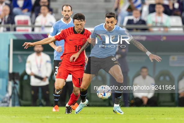 Jaesung Lee , Matias Vecino  during the World Cup match between Spain v Costa Rica, in Doha, Qatar, on November 23, 2022. 