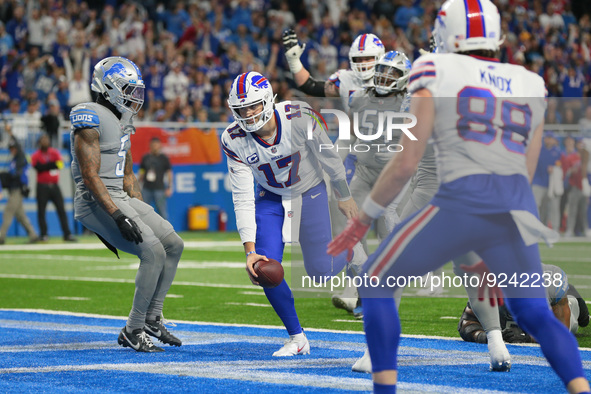 Buffalo Bills quarterback Josh Allen (17) scores a touchdown during the first half of an NFL football game between the Detroit Lions and the...