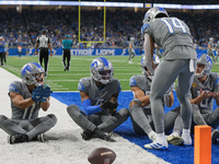 Detroit Lions wide receiver Amon-Ra St. Brown (14) celebrates his touchdow with teammates during the first half of an NFL football game betw...