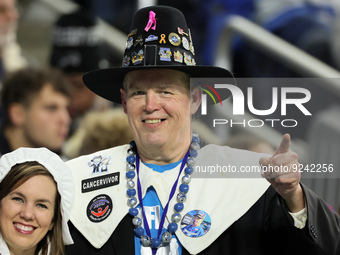 A fan dressed as a pilgrim for the Thanksgiving game cheers from the stands during an NFL football game between the Detroit Lions and the Bu...
