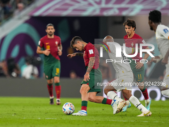 (25) OTAVIO of Portugal team battel on ball with (10) AYEW Andre of Ghana team during FIFA World Cup Qatar 2022  Group H football match betw...