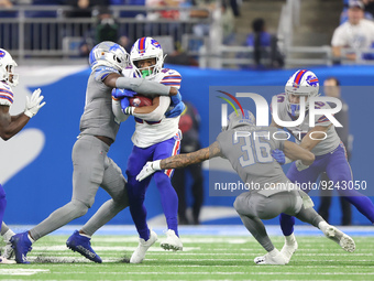 Buffalo Bills running back Nyheim Hines (20) is tackled by Detroit Lions safety Kerby Joseph (31) during the second half of an NFL football...