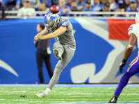 Detroit Lions punter Jack Fox (3) kicks during an NFL football game between the Detroit Lions and the Buffalo Bills in Detroit, Michigan USA...
