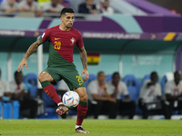 Joao Cancelo Left-Back of Portugal and Manchester City controls the ball during the FIFA World Cup Qatar 2022 Group H match between Portugal...
