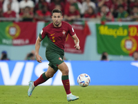 Raphael Guerreiro Left-Back of Portugal and Borussia Dortmund runs with the ball during the FIFA World Cup Qatar 2022 Group H match between...