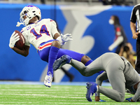 Buffalo Bills wide receiver Stefon Diggs (14) is tackled by Detroit Lions safety Kerby Joseph (31) during an NFL football game between the D...