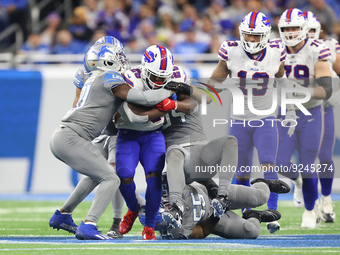 Buffalo Bills running back Devin Singletary (26) is tackled by Detroit Lions linebacker Alex Anzalone (34) during the second half of an NFL...