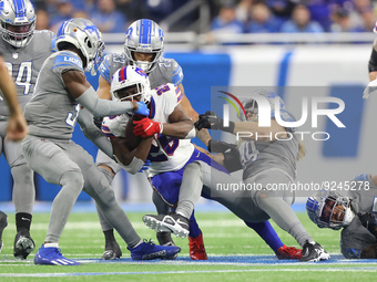 Buffalo Bills running back Devin Singletary (26) is tackled by Detroit Lions linebacker Alex Anzalone (34) during the second half of an NFL...