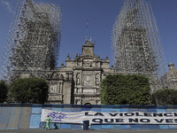 View of a banner outside the Metropolitan Cathedral in Mexico City's Zócalo on metal fences with slogans to mark the International Day for t...