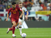 Marco Asensio right winger of Spain and Real Madrid and Joshua Kimmich Defensive Midfield of Germany and Bayern Munich compete for the ball...