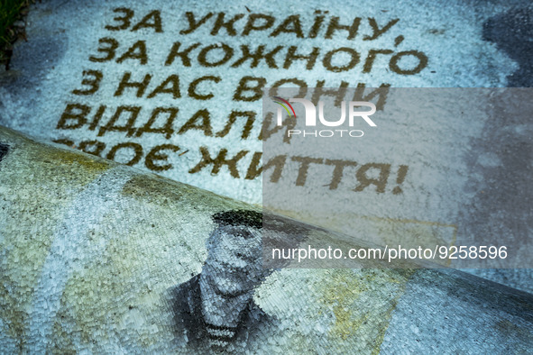 Glass remains of an army memorial in Nikopol. The glass panels of the memorial with photos of killed ukrainian soldiers in Donbass war melte...