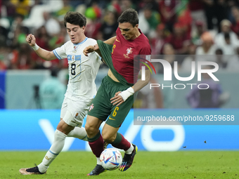 Joao Palhinha defensive midfield of Portugal and Fulham FC and Facundo Pellistri Right Winger of Uruguay and Manchester United compete for t...