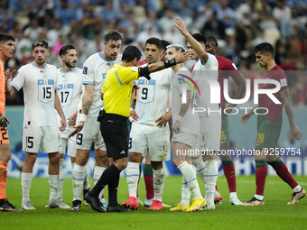 Uruguay players protest to referee during the FIFA World Cup Qatar 2022 Group H match between Portugal and Uruguay at Lusail Stadium on Nove...