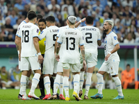 Uruguay players protest to referee during the FIFA World Cup Qatar 2022 Group H match between Portugal and Uruguay at Lusail Stadium on Nove...