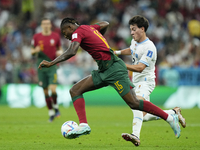 Rafael Leao left winger of Portugal and AC Milan and Facundo Pellistri Right Winger of Uruguay and Manchester United compete for the ball du...