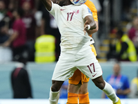 Ismaeel Mohammed right winger of Qatar and Al-Duhail SC and Daley Blind left-back of Netherlands and Ajax Amsterdam compete for the ball dur...