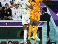 Homam Ahmed left-back of Qatar and Al-Gharafa SC and Denzel Dumfries right midfield of Netherlands and Inter Milan compete for the ball duri...