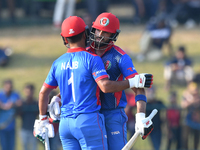 Afghanistan's Ibrahim Zadran (R) celebrates his fifty during the final one-day international cricket match between Sri Lanka and Afghanistan...