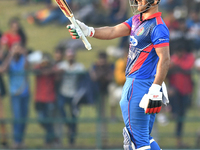 Afghanistan's Najibullah Zadran celebrates his fifty during the final one-day international cricket match between Sri Lanka and Afghanistan...