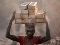 Seasonal Migrant workers during work at a brick-making field in Dhaka, Bangladesh on November 30, 2022. (