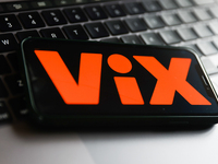 ViX logo displayed on a phone screen and a laptop keyboard are seen in this illustration photo taken in Poland on November 30, 2022. (