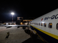 People board a Ryanair Boeing 737-800 airplane at Treviso A. Canova International Airport (TSF) in Treviso, Italy, on November 27, 2022. (